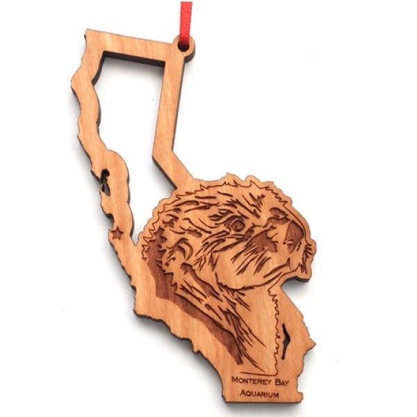 Wood ornament sea otter face
