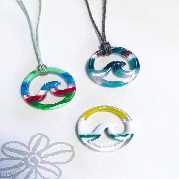 Upcycled surfboard resin wave on a cord necklace